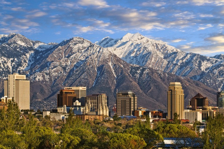 Skyline of downtown Salt Lake City with the Towering Wasatch Mountain range in the background. Photo Courtesy of Utah Tourism.