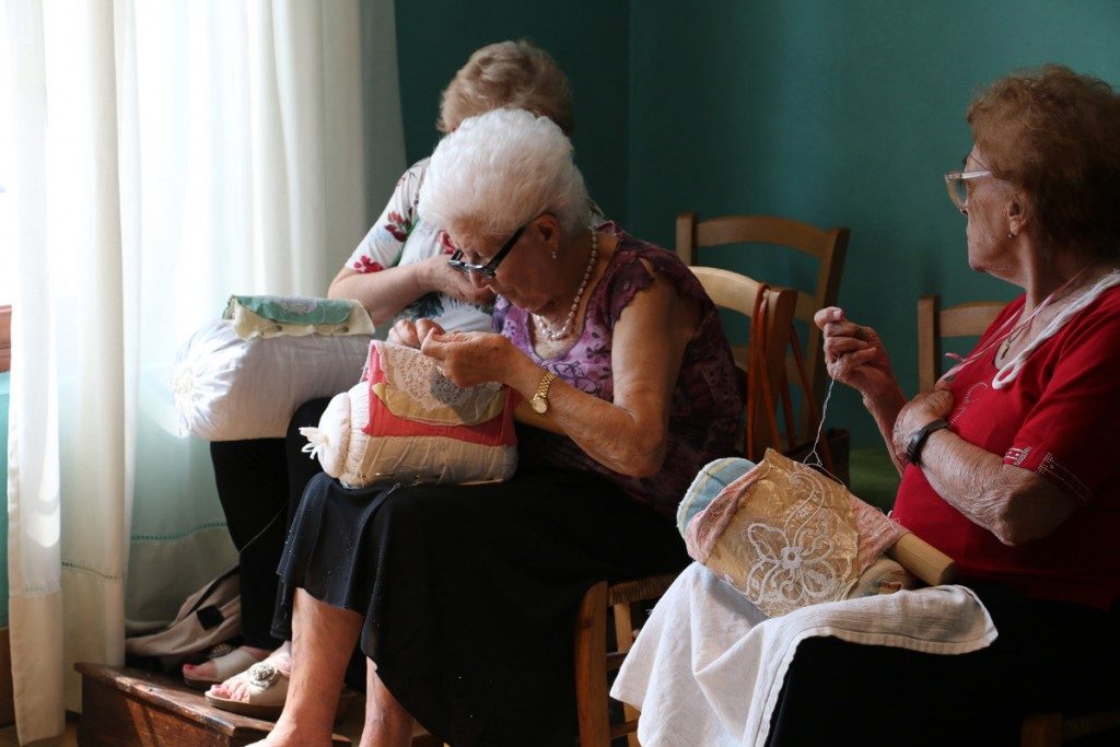 Old ladies in Burano stitching lace by hand by MikesRoadTrip.com