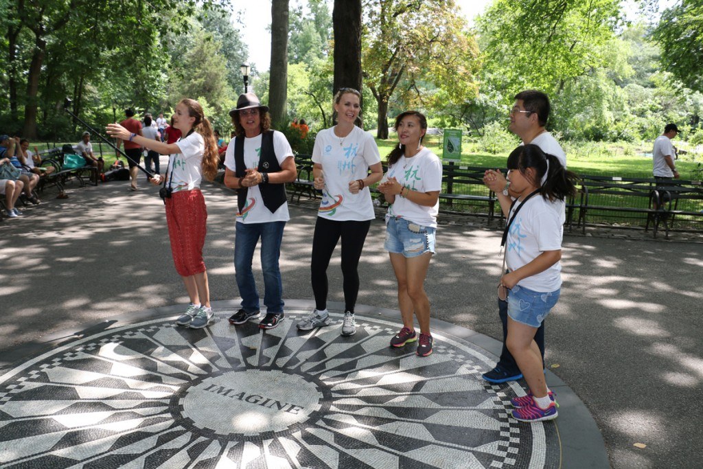 People around Imagine marker in Central Park