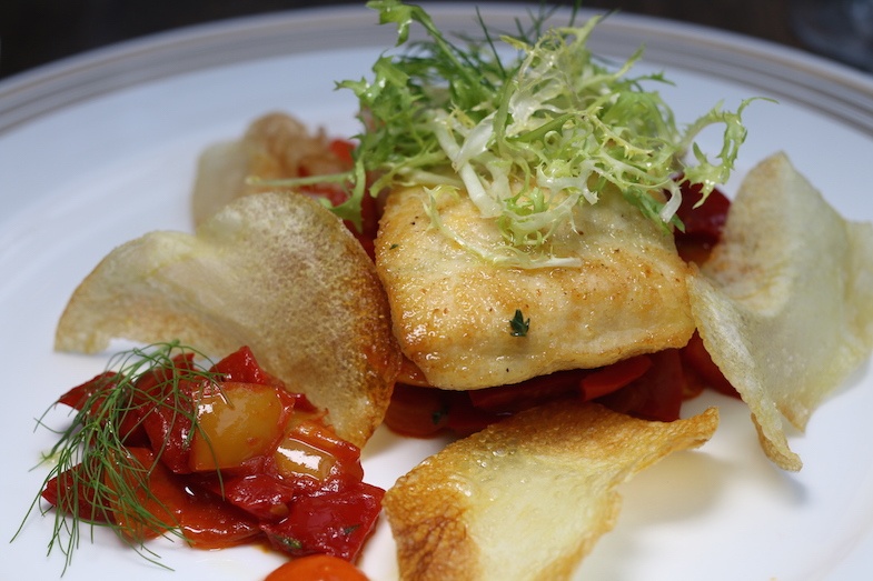 Sturgeon with rouille sauce, bell pepper ratatouille, frisee and potato crips