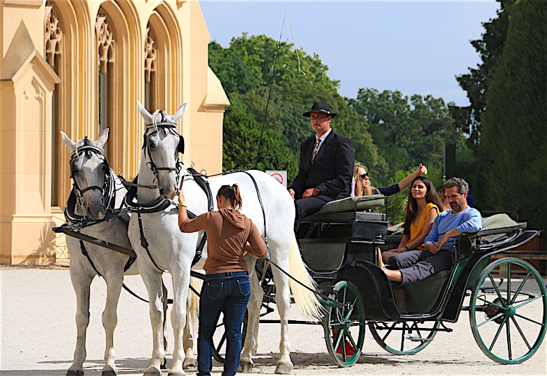 Horse drawn carriage in front of Lednice Chateau by MikesRoadTrip.com