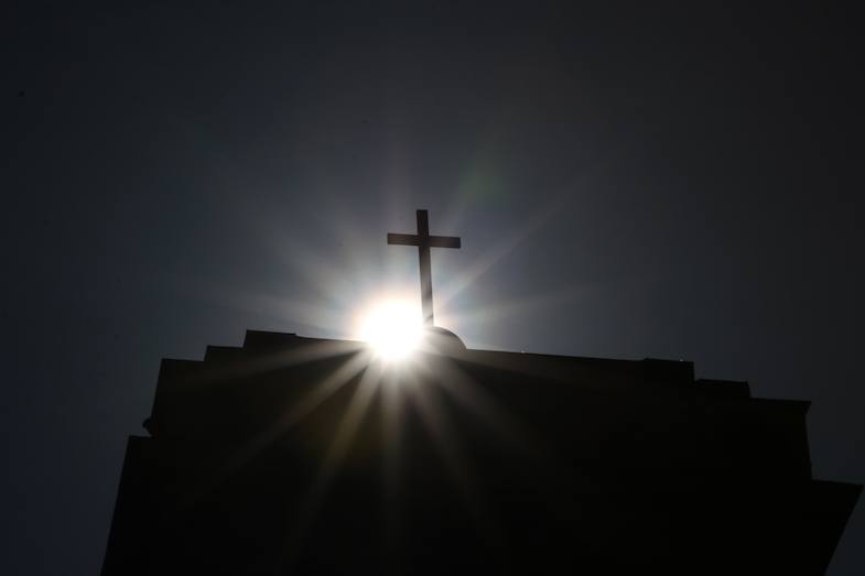 Church cross with sun starburst by MikesRoadTrip.com