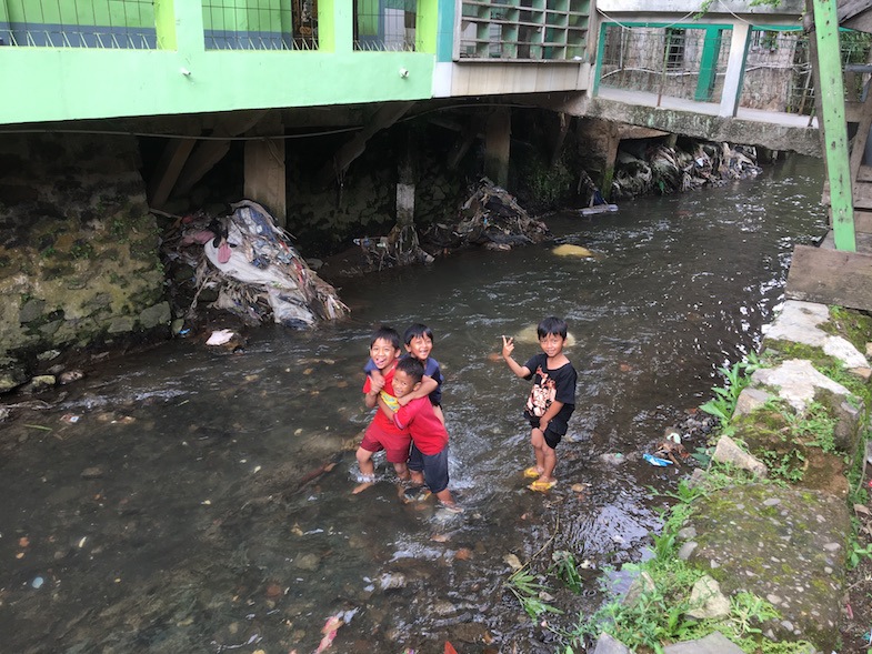 Kids playing in stream in Bandung Indonesia - Photo by MikesRoadTrip.com