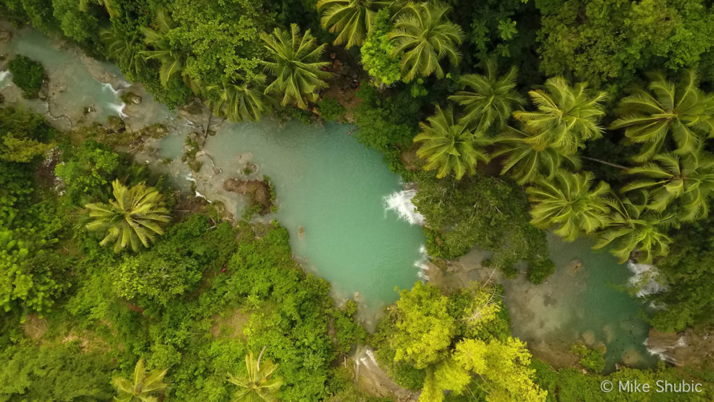 Aerial of Cambugahay Falls on Siquijor island in the Philippines by MikesRoadTrip.com