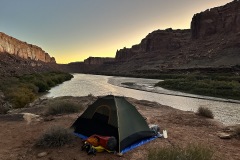 Tent at sunset on cliff