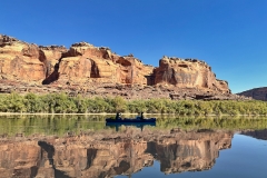 Solo-canoe-on-green-river