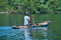 Fisherman-in-wooden-kayak