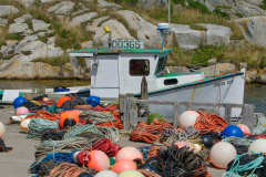 Colored ropes next to fishing vessel at Peggy's Cove