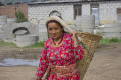 Woman carrying basket Woman carrying basket