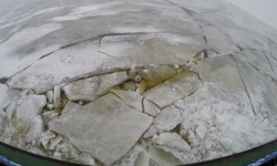 Frozen ocean breaking as Sampo Icebreaker passes