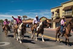 Cowboys-riding-down-Wickenburg-Way