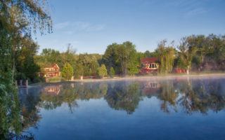 Gervasi Vineyard over pond in the morning by MikesroadTrip.com