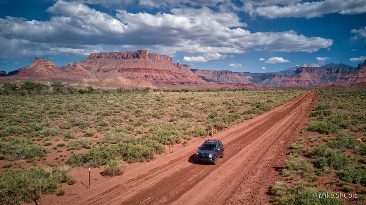 Kia Sportage on dirt road in Moab by Mike Shubic