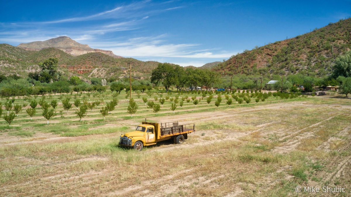 Aravaipa Farms Orchard & Inn Farm with old farm truck aerial by MikesRoadTrip.com