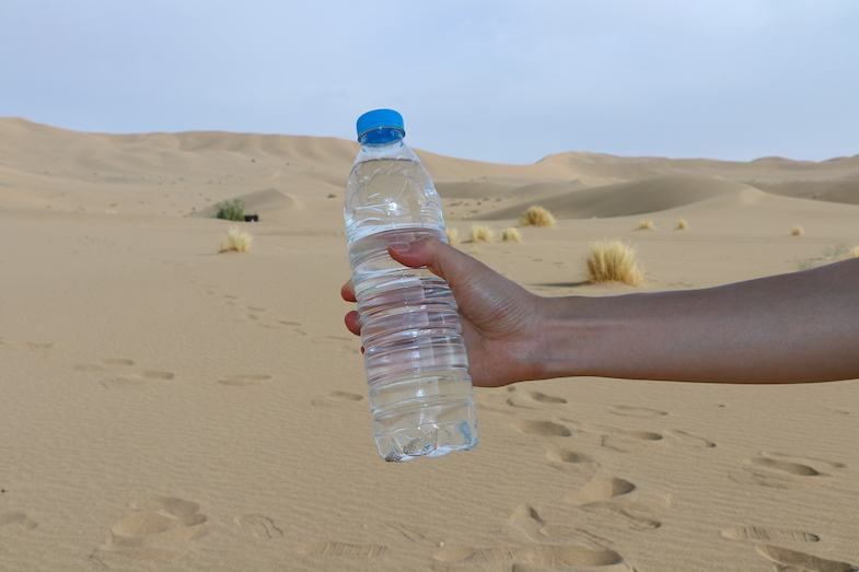 Bottle of water in the Gobi Desert by MikesRoadTrip.com