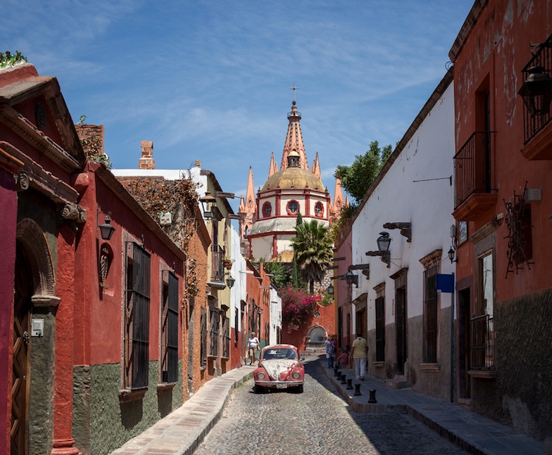 Cathedral of San Miguel de Allende in Mexico Behind Colorful Mexican Buildings