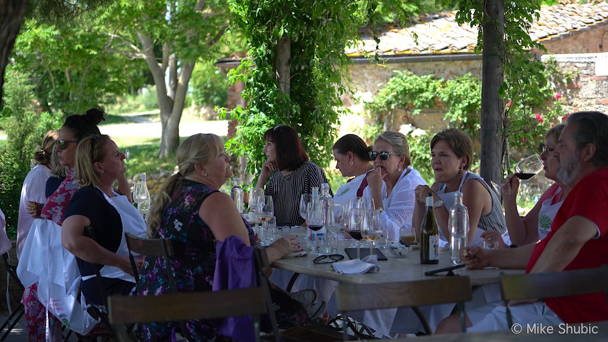 Cook in Tuscany guests at lunch by Mike Shubic of MikesRoadTrip.com