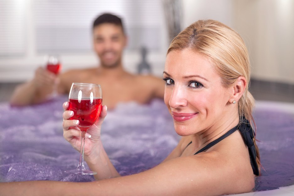 Couple having cocktails in hot tub in Jamaica