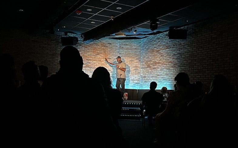 Kevin Bozeman on stage at the Comedy Club on State in Madison, WI