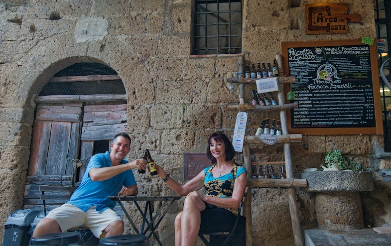 My Sister Susanne and I drinking beer at L’Arco restaurant in Civita di Bagnoregio